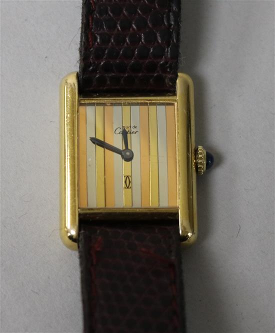 A ladys silver gilt Must de Cartier manual wind wrist watch.